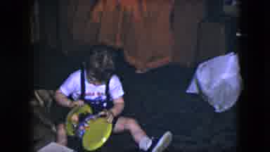Cleveland Ohio-1951: Baby Boy Plays With Carousel Toy On Floor