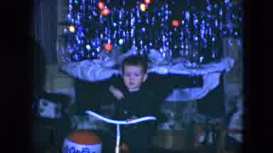 Cleveland Ohio (1951): Boy Enjoys Christmas Gifts In Front Of The Decorated Tree
