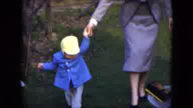Cleveland Ohio (1951): Father Helps Son Walk Across The Lawn As He Is Still
