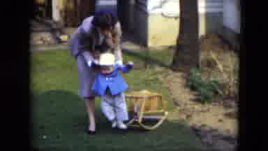 Cleveland Ohio (1951): A Woman Bring The Baby Off From The Toy And Help Him Learn