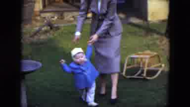 Cleveland Ohio (1951): Woman In Yard With Small Baby Helping With Taking First