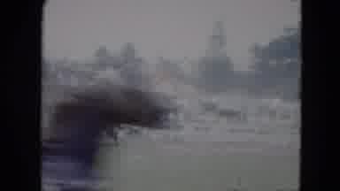 Cleveland Ohio (1951): A Horse Pulling A Man On A Wheel Chair Across A Track As