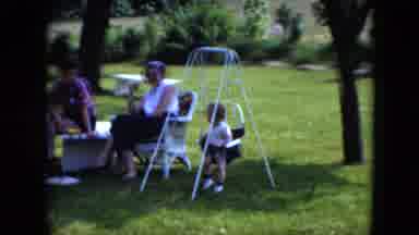 Cleveland Ohio (1951): A Family Members Are Sit In The Garden And Dog Go To Family