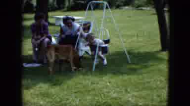 Cleveland Ohio (1951): Baby Watches Dog Drink Water From Bowl On A Sunny Day