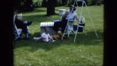 Cleveland Ohio-1951: A Family Playing Outside A Dad Reading The Paper A Baby