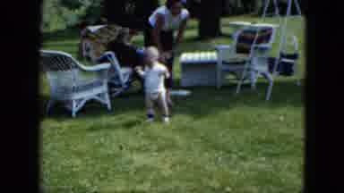 Cleveland Ohio (1951): A Mon Sitting Outside While Young Child Is Playing