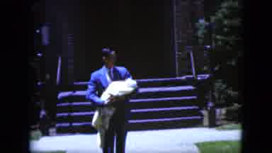 CLEVELAND OHIO-1951: Proud Father Carries A Bundled Baby Out Of Building