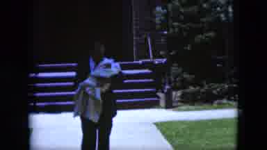Cleveland Ohio (1951): Man In Suit Walking With Baby Wrapped Blanket Outside