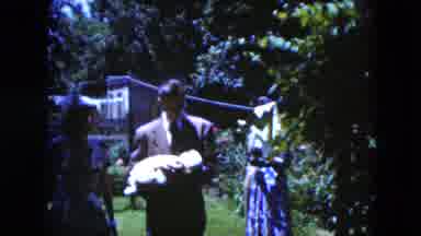 Cleveland Ohio (1951): Group Of People In Garden With Man Holding His Baby And