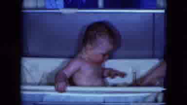 Cleveland Ohio (1951): Baby Sneezes While Sitting In White Bassinet Tub