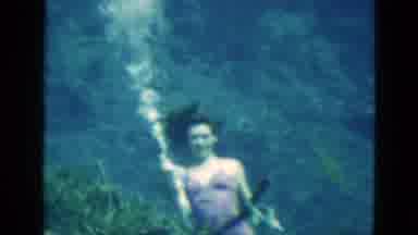 Florida USA (1952): Woman Underwater Performer In A Aquarium Taking A Break To Get