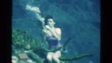Florida USA (1952): A Woman Drinks Water Beneath Herself Many Lot Of Fishes Are