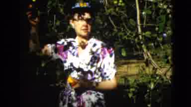 Quebec Canada (1952): Lady Strolling Through Garden Trees Picking Fruit With
