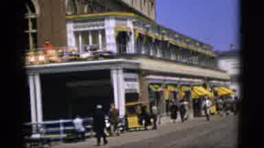 Quebec Canada (1952): Camera Pans Up To See Person On A Balcony Fixing Up Chairs