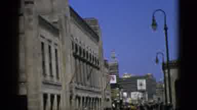 Quebec Canada (1952): A Crowd Walks Down An Urban Street Flanked By Buildings And