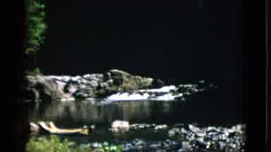 Quebec Canada-1952: View Of Brook With Small Waterfall And Blue Sky On A Sunny Day