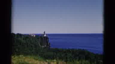 Quebec Canada (1952): Grey Tower Overlooking Deep Blue Ocean Water On A Sunny Day