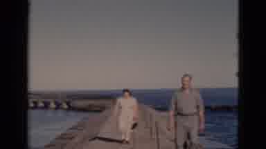 QUEBEC CANADA-1952: Couple Walks By Pier Leading To Beautiful Waterfall On