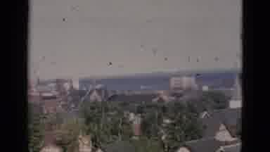 Quebec Canada (1952): The View Of A Town And A Old Woman Is Walking In The Garden