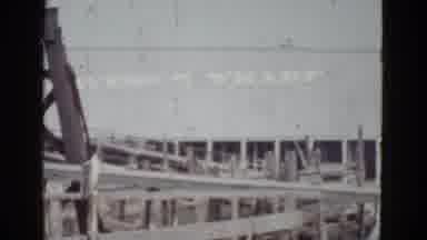 New Orleans USA (1952): People Discussing And Moving Around At Workplace At Wharf