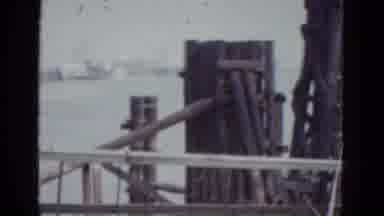 New Orleans USA (1952): Group Of Brown Wooden Structures Behind Ribbon Barrier On