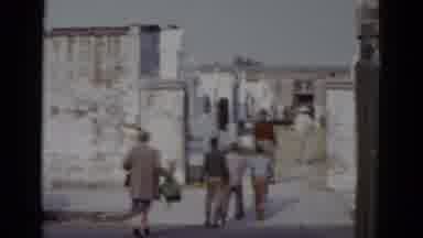New Orleans USA (1952): Group Of People Walking Inside A Building