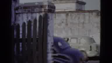 New Orleans USA (1952): Camera Pans Through Old Time Setting With Cars And Walls