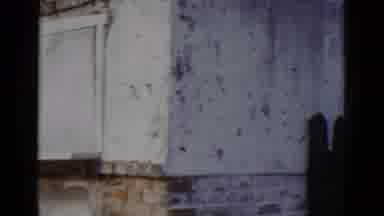 New Orleans USA (1952): White Weather Worn Multi-Storey Building With Windows