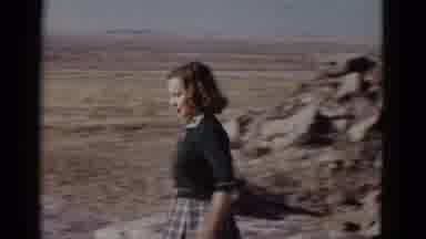 Arizona USA-1952: Sammie Walks Through Desert Landscape Past Trail Sign