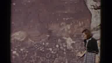 Arizona USA (1952): A Woman Standing In Front Of A Large Rock Formation