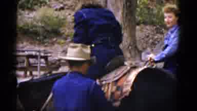 Arizona USA (1952): Man Adjusting Saddles For Woman On Horseback