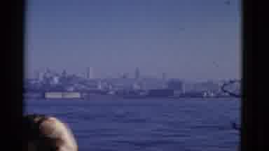 San Francisco California (1952): People Riding On A Boat Past The Hilly Shoreline