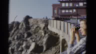 San Francisco California (1952): Woman Using Binoculars To View Cliff Over Water