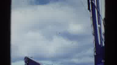 San Francisco California (1953): A Passenger Plane Flying High Up In The Sky On A