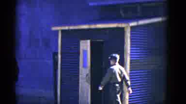 San Francisco California (1953): Several People Walk By A Makeshift Building On A