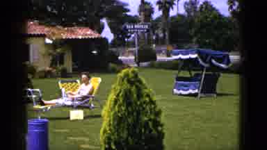 New Mexico USA (1953): Woman Sitting On Bright Yellow Lawn Chair In A Park