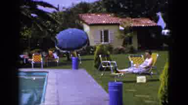 New Mexico USA (1953): Man Relaxing By Modest Family Pool In Summer At Nice Home