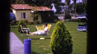 New Mexico USA (1953): A Woman Is Walking Past A Hotel And A Sitting Women