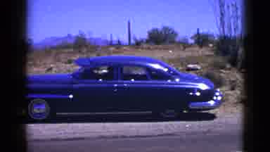 New Mexico USA (1953): A Car Pulled Over On The Shoulder Of A Road With A Desert