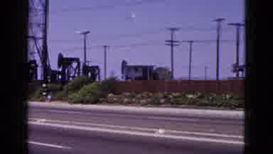 Palm Springs California (1953): Oil Field And Power Lines Near A Road People
