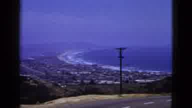 California USA-1953: Panoramic View Of Coastal Town From Roadside