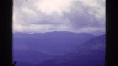 California USA (1953): Aerial View Of Several Mountains Then Showing Valley With