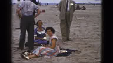 California USA (1953): Men And Women Relax And Enjoy Scenery On The Beach