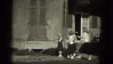 Milwaukee Wisconsin (1953): Five Girls Play Leapfrog Next To Old Stone Building On