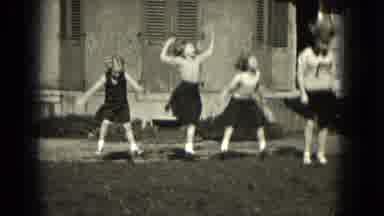 Milwaukee Wisconsin (1953): Young Lady Cheerleader Showing Steps Younger Girls