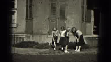 Milwaukee Wisconsin (1953): Group Of School Girls Playing In Front Of A Building