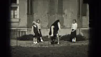 Milwaukee Wisconsin (1953): Cheerleader Practices A Forward Walkover And Waves