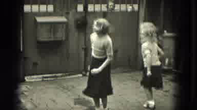 Milwaukee Wisconsin (1953): Little Girls Jumping Rope In The Garage With Their
