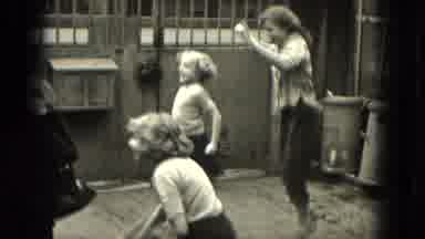 Milwaukee Wisconsin (1953): Two Girls Are Jumping Rope Together In The Outside Of