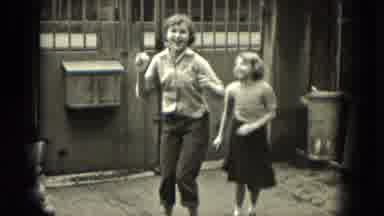Milwaukee Wisconsin (1953): Two Energetic Girls Happily Taking Turns Playing Jump